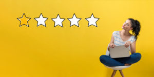 One star rating with woman using a laptop